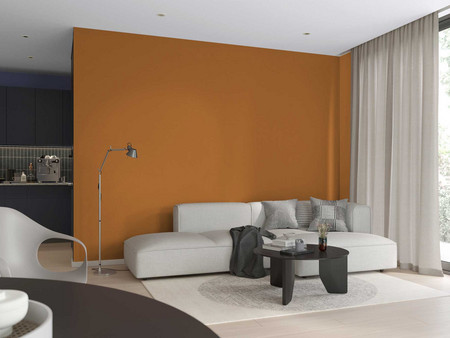 Modernes Wohnzimmer mit Sofagarnitur, rundem Couchtisch, eleganter Stehlampe und orangefarbener Wand